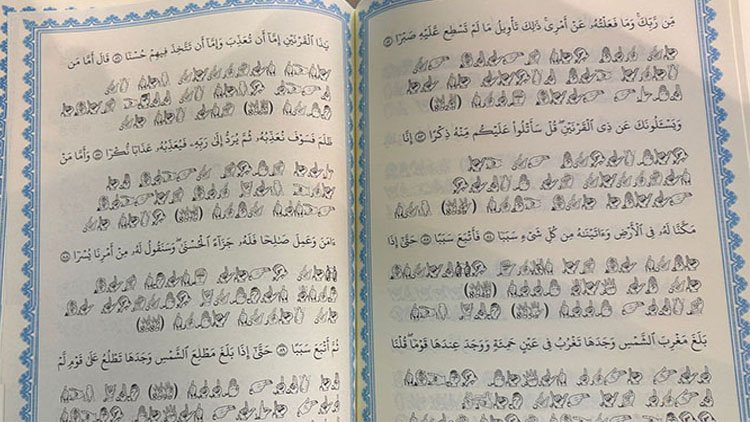 Dünyada ilk: Kürt öğretmen Kur'an'ın tamamını işaret diliyle yazdı